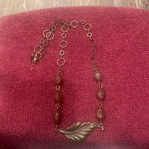 Necklace, with leaf, and six stones.